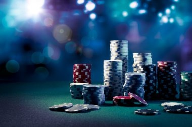 mpocasino live-dealer studio with professional dealers at blackjack and roulette tables